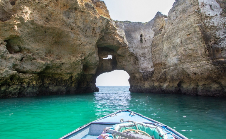 This beach has high cliffs and caves and you can navigate through them